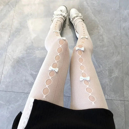 Dámské punčocháče s výřezy a mašlemi