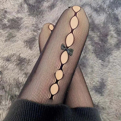 Dámské punčocháče s výřezy a mašlemi