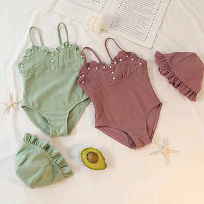 Jednodílné plavky s perlami a kloboukem pro dívky