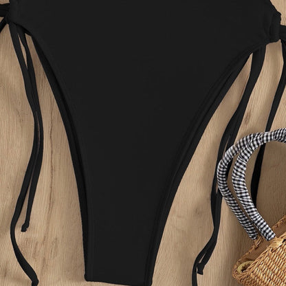 Jednodílné plavky Monokini s detailem zavazování a výstřihem do V