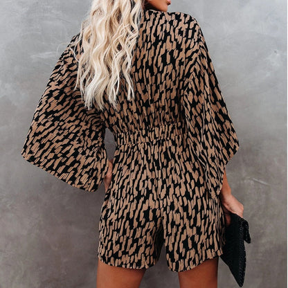 Elegantní overal s dlouhým rukávem a zavazováním